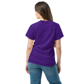 Back view of a woman wearing a Unisex classic tee in purple, showcasing its comfortable fit and style.