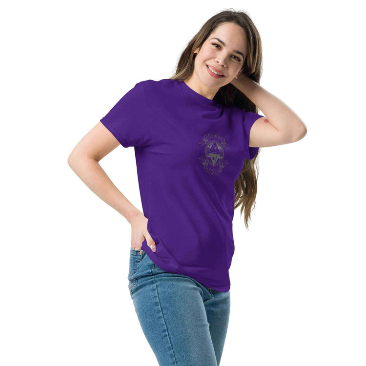 Unisex classic tee in purple worn by a smiling woman, showcasing a trendy and structured look.
