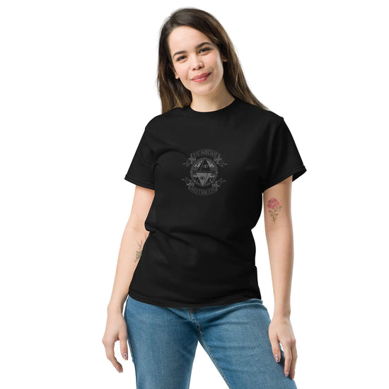 Model wearing a black unisex classic tee with a graphic print on the front, showcasing its stylish design.